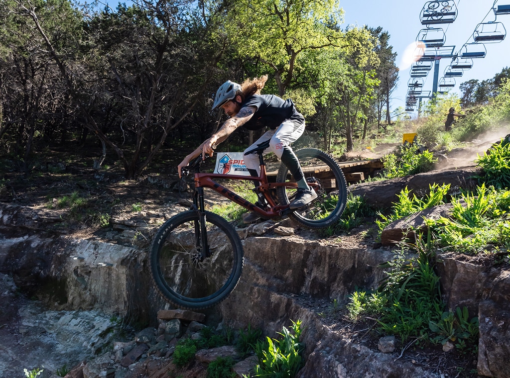 Rider sending the drop on Sleep TIght at Spider Mountain Bike Park