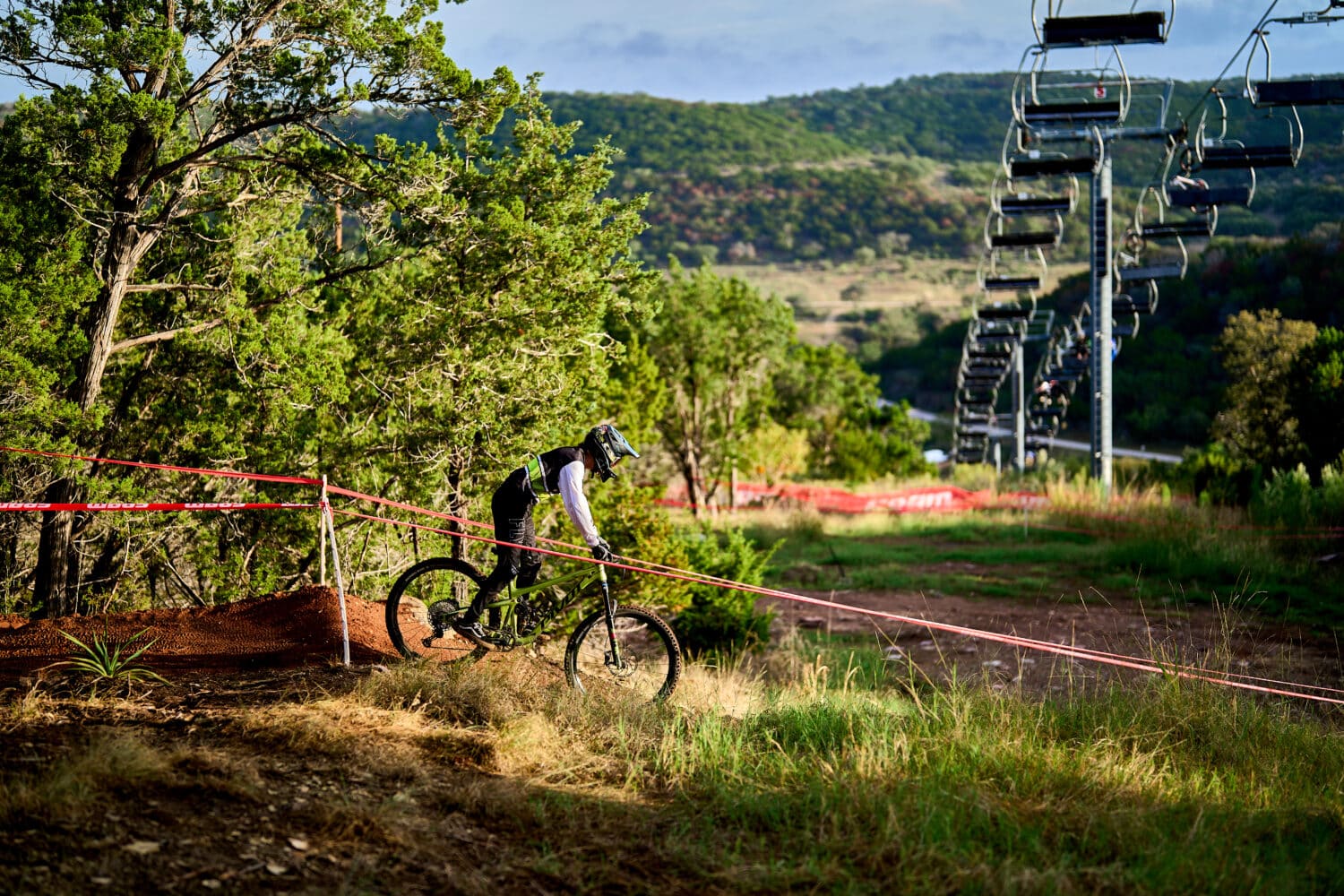 Biker cruising under Texas Eagle lift